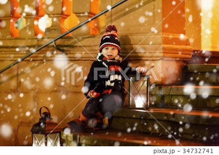 Little cute kid boy with with a light lantern on Little cute kid boy with with a light lantern on 34732741