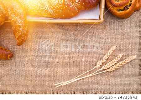 Bakery products lying on a tablecloth 34735843