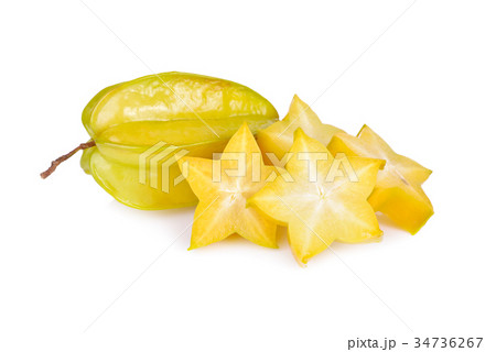 whole and sliced ripe star fruit on white 34736267
