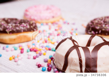 Different type of donuts on white wooden Different type of donuts on white wooden 34736306