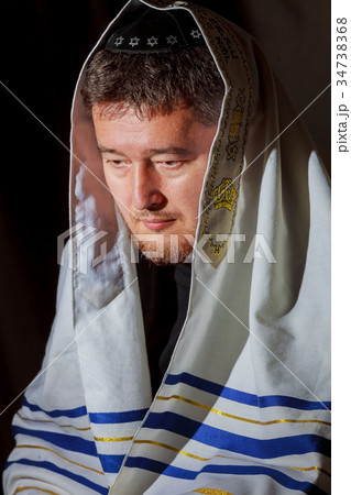 Ultra Orthodox Jewish man praying in the morning. Ultra Orthodox Jewish man praying in the morning. 34738368