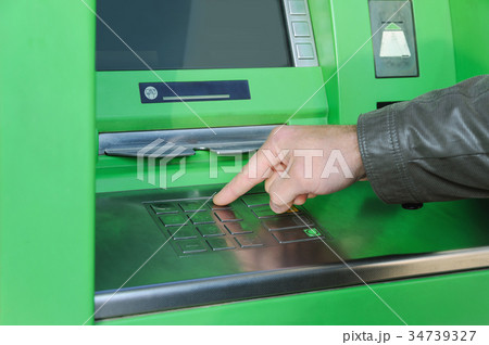 A man's hand is pushing the button. A man's hand is pushing the button. 34739327