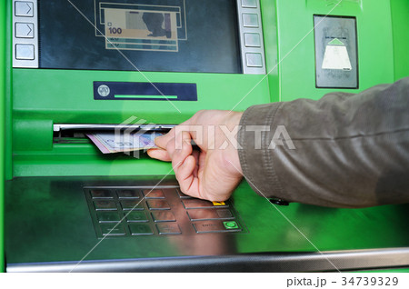 A hand with money. A hand with money. 34739329