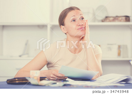 Woman worried about debts 34743948