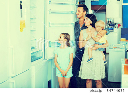 family choosing new fridge family choosing new fridge 34744035