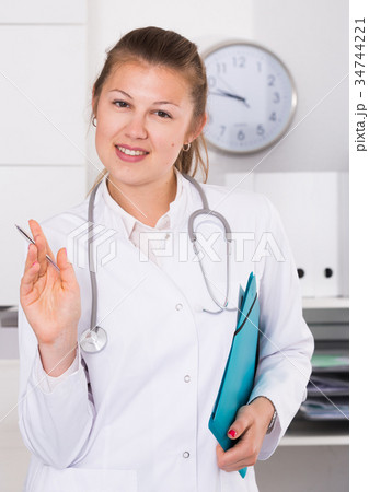 Girl is standing with documents 34744221