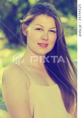 Portrait of girl which is sitting on bench Portrait of girl which is sitting on bench 34744525