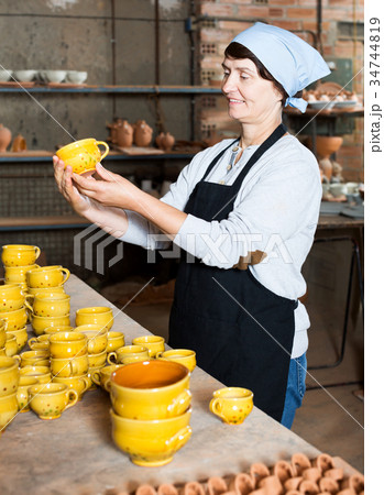 Female elderly master among the pottery 34744819