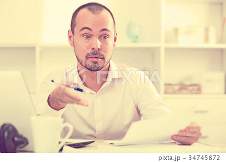 Young businessman talking in office 34745872
