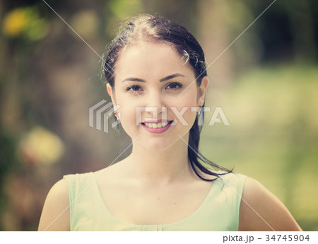 cheerful smiling young woman portrait in outdoors cheerful smiling young woman portrait in outdoors 34745904
