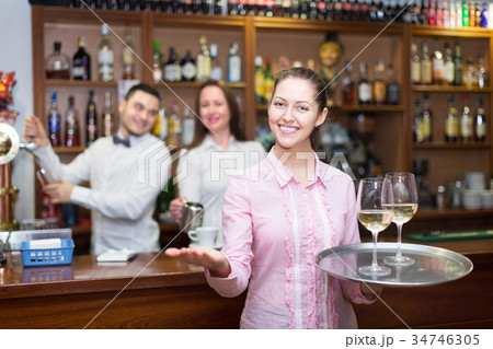 Waitress and barmen working Waitress and barmen working 34746305