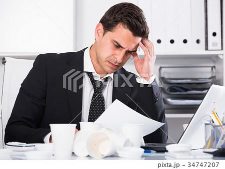 Businessman working in hot office Businessman working in hot office 34747207