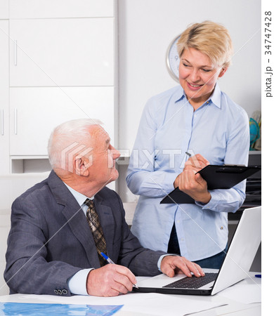 Manager and secretary working 34747428