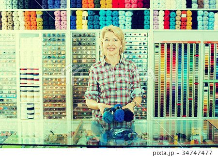 Woman seller with yarn balls 34747477