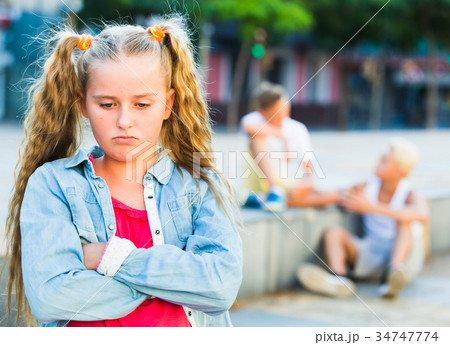 Sad girl having problems in relationship with friends Sad girl having problems in relationship with friends 34747774