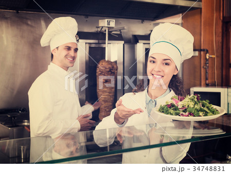Staff posing at kebab counter 34748831