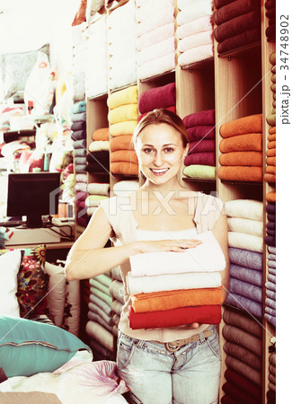 Female customer choosing towels Female customer choosing towels 34748902