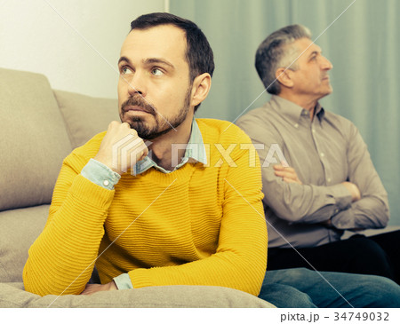 Adult father and son solve problems Adult father and son solve problems 34749032