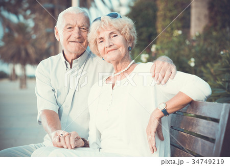 smiling male and female hugging 34749219