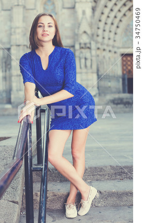 Elegant girl is posing in blue dress Elegant girl is posing in blue dress 34750469