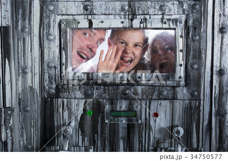 Portrait of a mad father with children who are behind a closed door 34750577