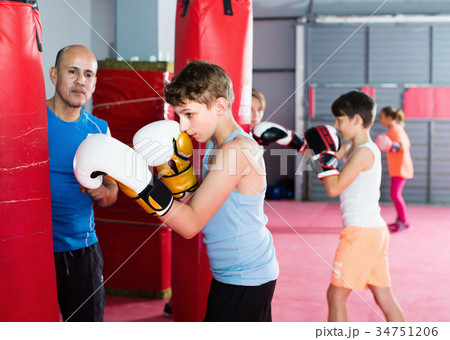 Teenage boy training at boxing at gym Teenage boy training at boxing at gym 34751206