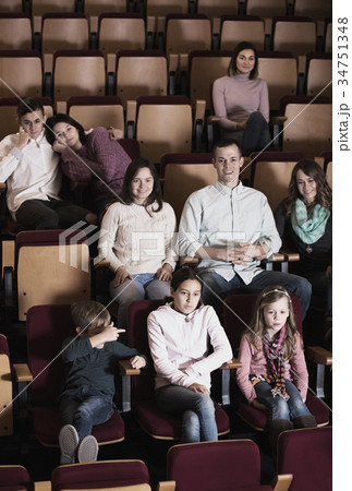 A group of people attentively watching interesting film 34751348