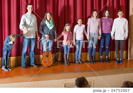 Performers bowing to audience after concert 34752007