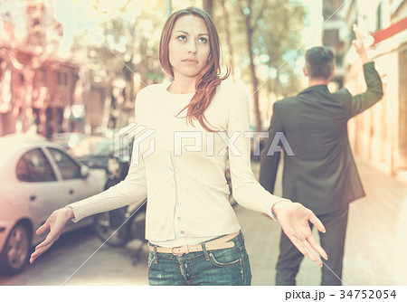 Young brunette in quarrel with boyfriend Young brunette in quarrel with boyfriend 34752054