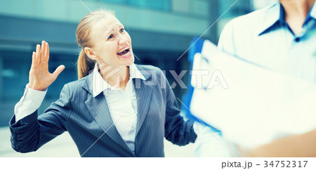 Angry businesswoman is chastising the employee Angry businesswoman is chastising the employee 34752317