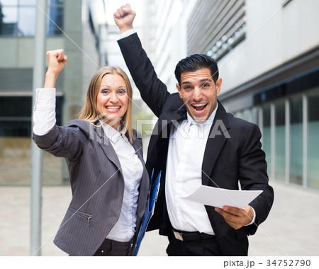 Young managers are satisfied of successful contract 34752790