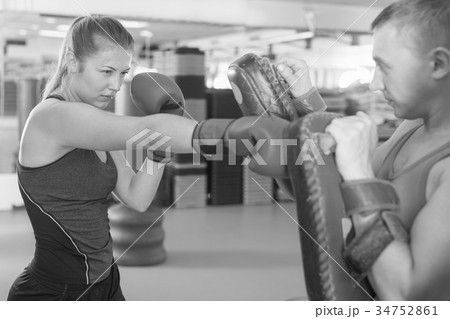 Woman training punch in gym Woman training punch in gym 34752861