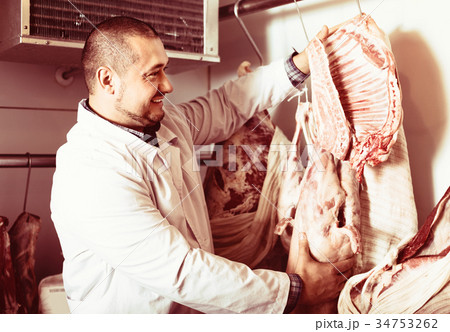 staff selling halal meat staff selling halal meat 34753262