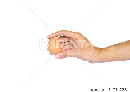 Man hand holding one egg isolated on white 34754228