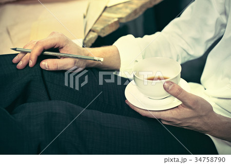 Architect working on drawing table in office Architect working on drawing table in office 34758790