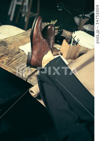 Architect working on drawing table in office Architect working on drawing table in office 34758809