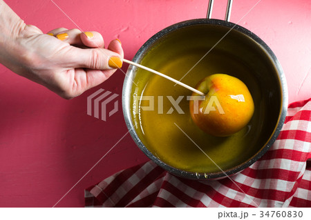 Cooking caramel apple for Thanksgiving holiday Cooking caramel apple for Thanksgiving holiday 34760830