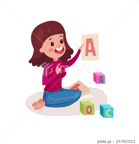 Smiling female teacher sitting on the floor 34762022