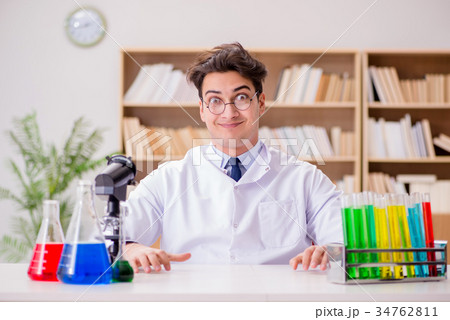 Mad crazy scientist doctor doing experiments in a 34762811