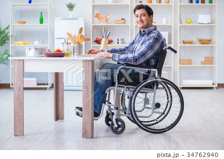 Disabled young man husband working in kitchen Disabled young man husband working in kitchen 34762940