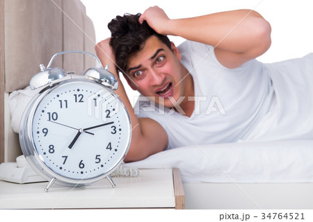 Man in bed suffering from insomnia 34764521