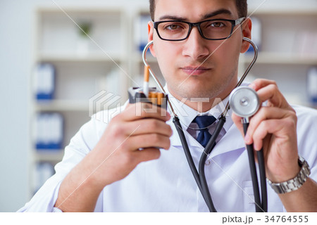 Male doctor in anti-smoking conceptwithcigarette Male doctor in anti-smoking conceptwithcigarette 34764555