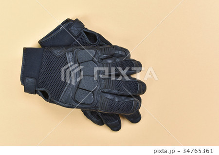 leather and textile gloves for riding a motorcycle leather and textile gloves for riding a motorcycle 34765361