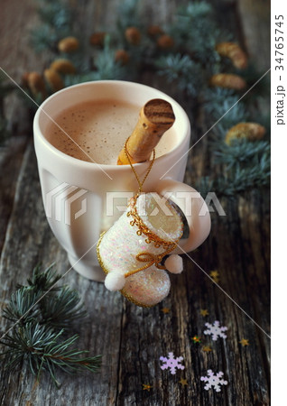 Milk coffee and New Year's decorations Milk coffee and New Year's decorations 34765745