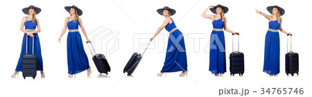 Young woman in blue dress and suitcase isolated on 34765746