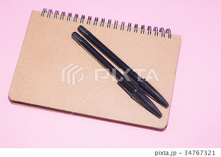 Wooden notepad and black pens 34767321