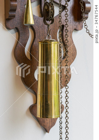 Brass weight on an old dutch clock 34767544