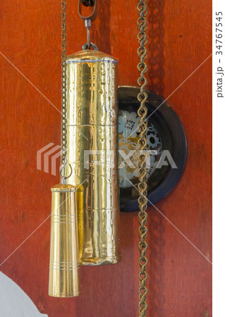 Brass weight on an old dutch clock 34767545
