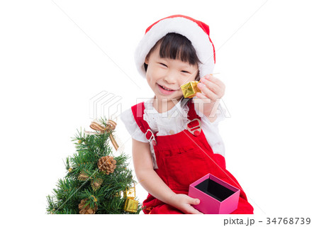 Little girl wearing santa claus red dress Little girl wearing santa claus red dress 34768739
