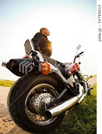 Biker on the country road 34769015